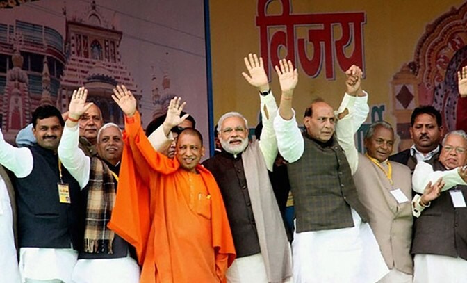 BJP MP Yogi Adityanath with Prime Minister Narendra Modi and Rajnath Singh. (Photo: PTI)